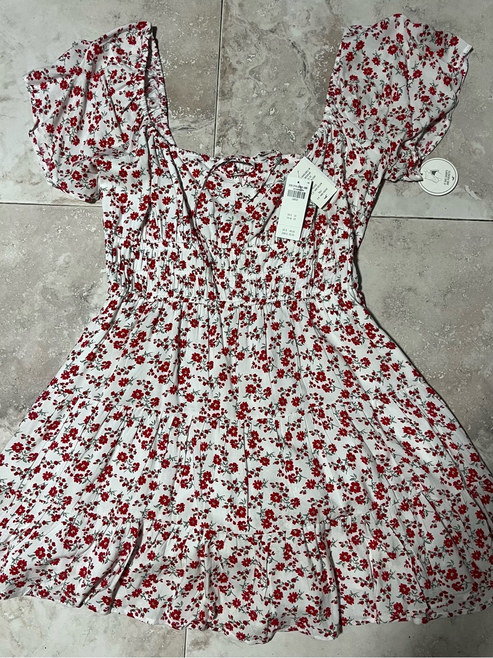 Hollister White Mini Dress with Red Floral Print with under shorts and pockets.